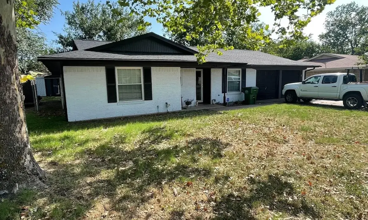 Professional roofing crew working on a residential roof in Sturbridge